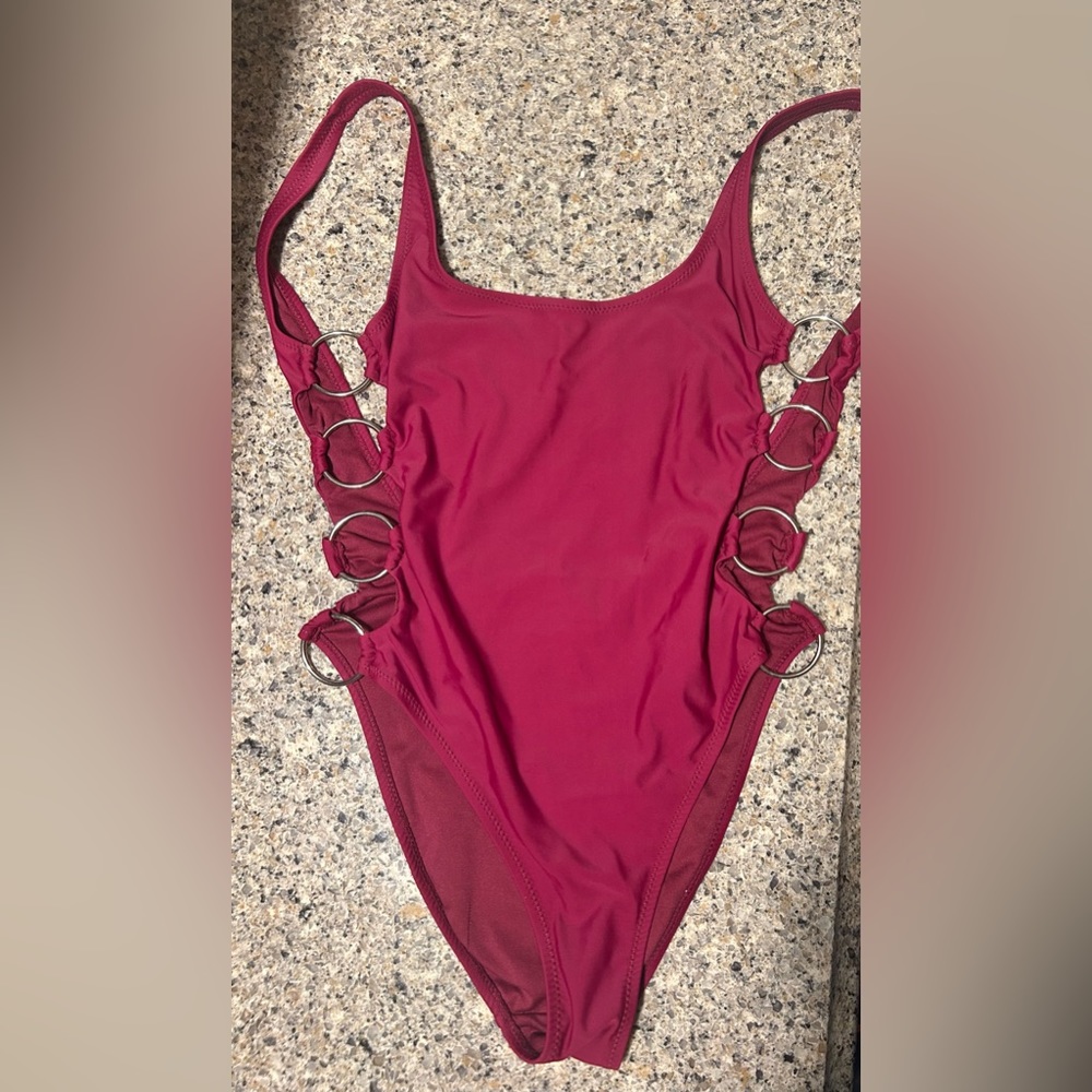 Low back small one piece swimsuit with side cutouts and rings small kensie suit.
